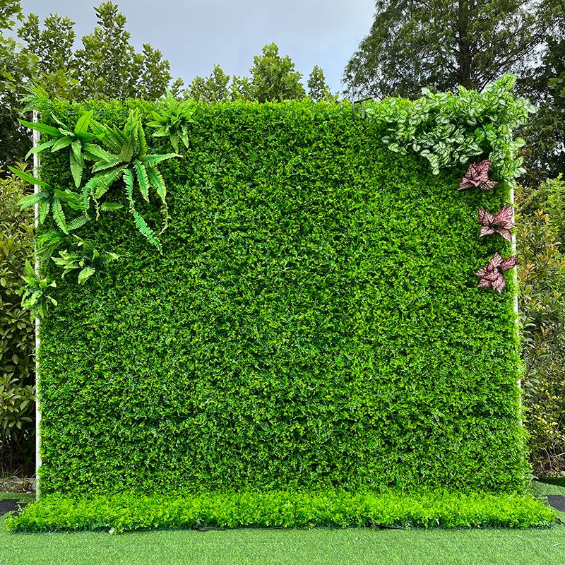 Artificial greenery wall backdrop for wedding & outdoor event decor.